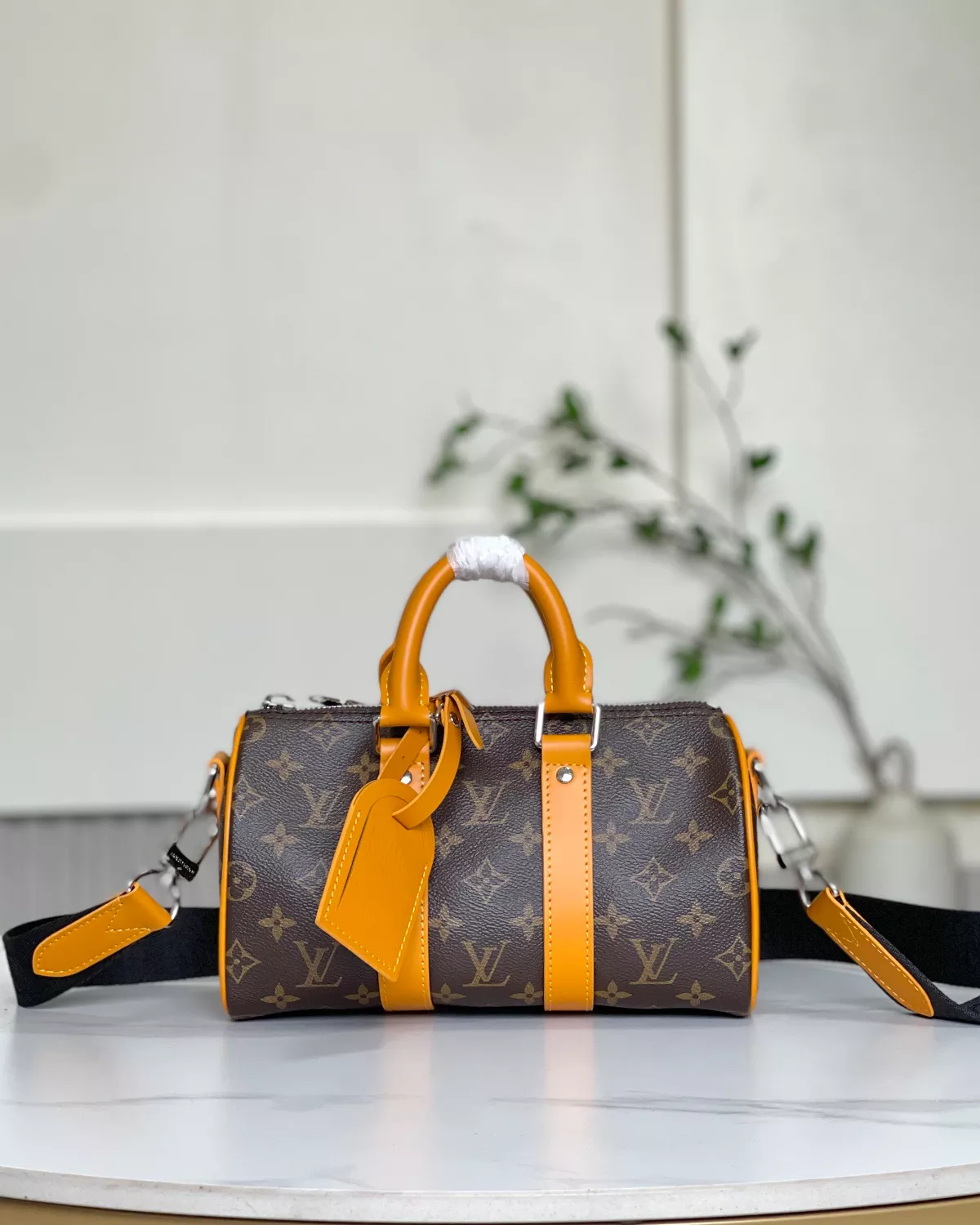 Keepall Bandoulière 25 bag in calf leather with oversized Monogram print.